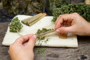 hands with rolling paper
