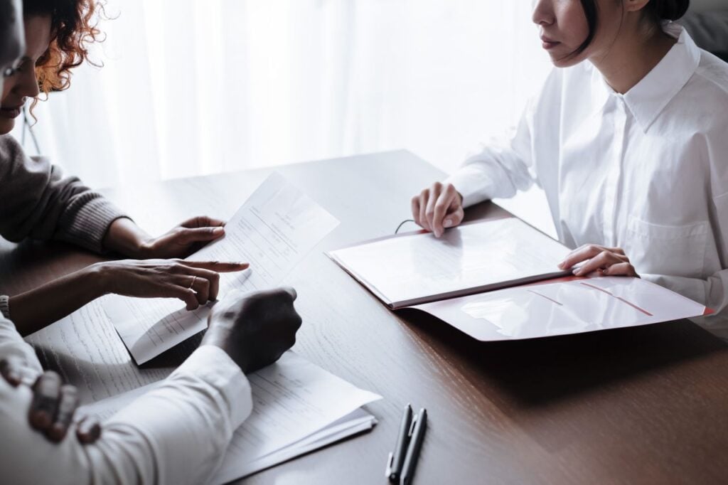 Photo by Ron Lach : https://www.pexels.com/photo/couple-sitting-at-table-with-documents-laying-on-it-9870132/