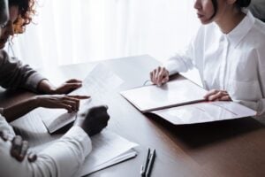 Photo by Ron Lach : https://www.pexels.com/photo/couple-sitting-at-table-with-documents-laying-on-it-9870132/