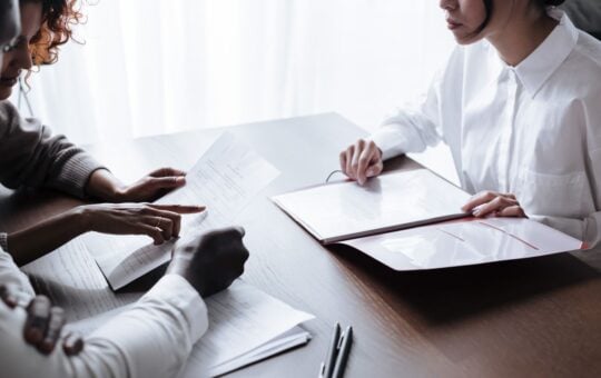 Photo by Ron Lach : https://www.pexels.com/photo/couple-sitting-at-table-with-documents-laying-on-it-9870132/