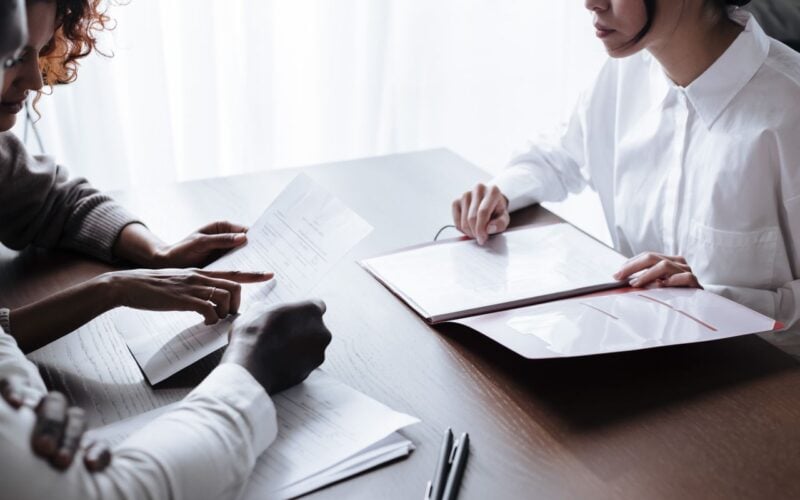 Photo by Ron Lach : https://www.pexels.com/photo/couple-sitting-at-table-with-documents-laying-on-it-9870132/
